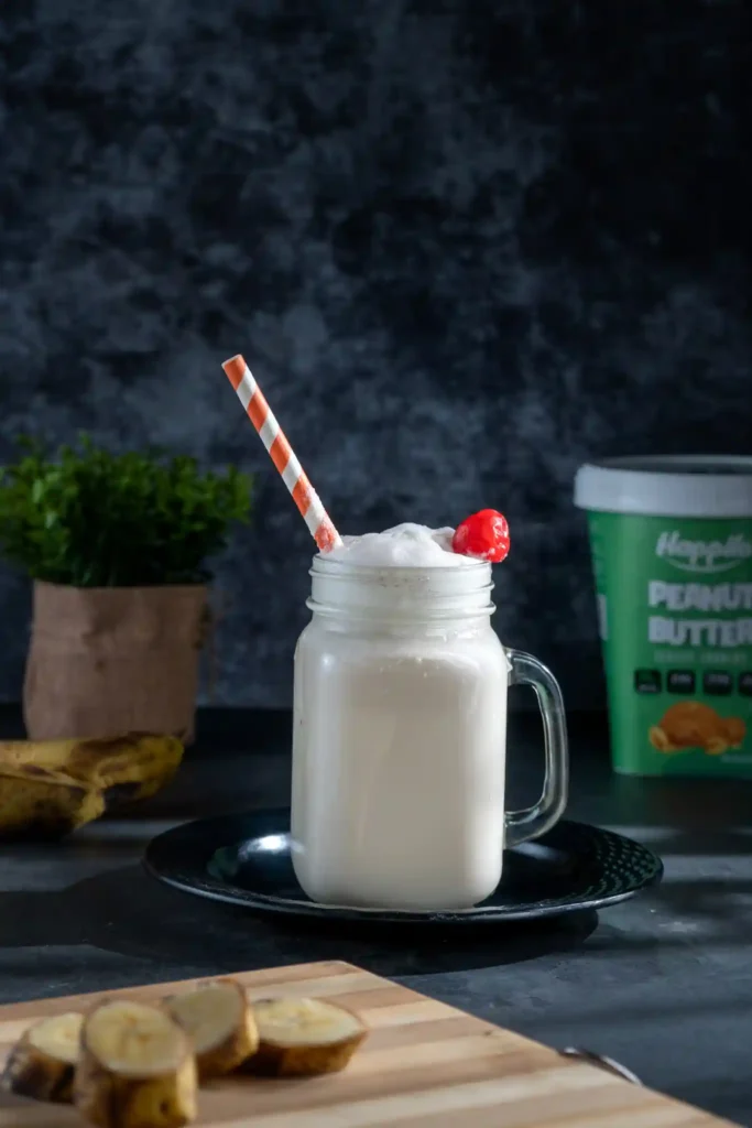 Banana Shake with cherry and straw