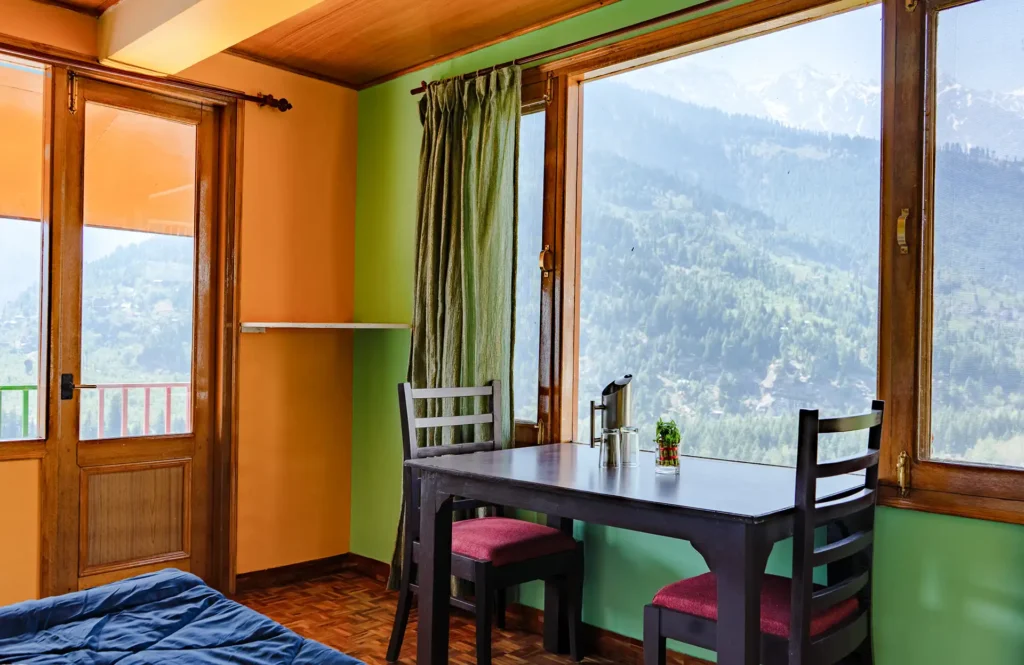 Hill view from windows of the colorful hotel room